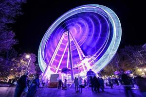 Ferris wheel at night at the fair in Granada. photo