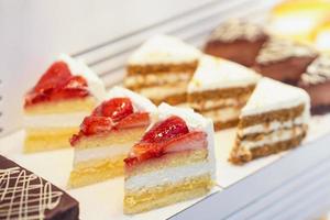 Cakes in the window of a bakery. photo