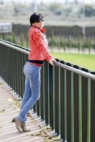 Mid aged woman wearing casual clothes outdoors photo