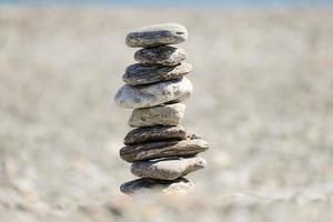 Pebbles in balancing on the beach photo