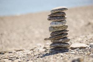 Pebbles in balancing on the beach photo