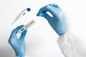 Doctor testing using the rapid test device for COVID-19 photo