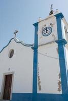 Traditional catholic church in Alentejo, Portugal. White and blue. photo