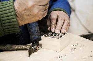 Close-up photgraph of a taracea craftsman working photo