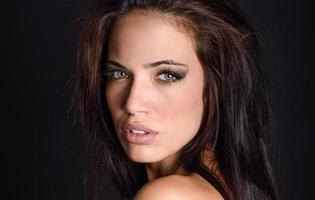 Beautiful young woman with green eyes photo