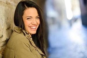 Young woman with green eyes in urban background photo