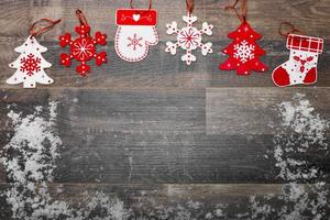 Christmas background with ornaments on wooden board photo