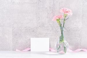 Mothers day handmade giftbox surprise wishes photography - Beautiful blooming carnations with pink ribbon box isolated on gray wallpaper design, close up, copy space, mock up photo