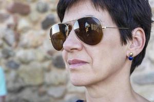 Woman wearing aviator sunglasses photo