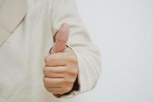 Close-up showing thumb-up expressing positive estimation.Approval concept photo