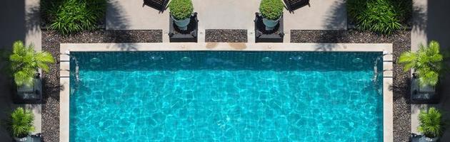 Aerial view images of swimming pool in a sunny day.