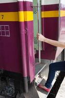Woman enters train photo