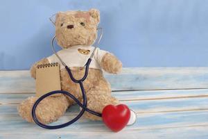 Children doctor concept Teddy bear with stethoscope  Pediatrician photo