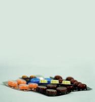 Colorful vitamin pills, capsules and medicine ampoules photo