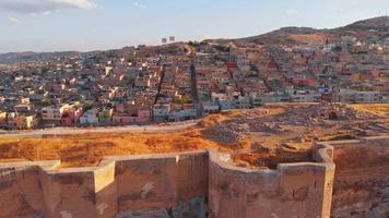 Aerial panning view ancient urfa castle walls in historical city of Sanliurfa. Turkey famous historical landmark video