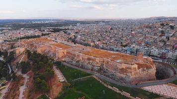 Aerial rising view historical Sanliurfa castle site in Urfa city. Famous travel destination in Turkey