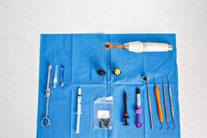 Aerial view of a table with a sterile tablecloth with tools for a dentist photo