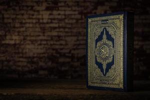 Koran holy book of Muslims  public item of all muslims  on the table , still life photo