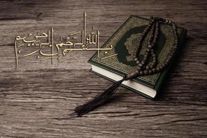 Bismillah  Mean In The Name Of Allah Arabic art  with Koran  holy book of Muslims  public item of all muslims . photo