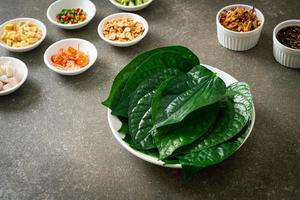 Miang kham - A royal leaf wrap appetizer photo