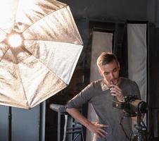 photographer in the process of shooting in the Studio photo