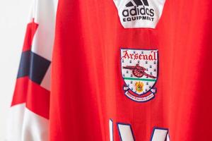 Bangkok, Thailand - Jan 18, 2022 - Arsenal logo on Arsenal retro shirt home jersey season 1992-1994 photo