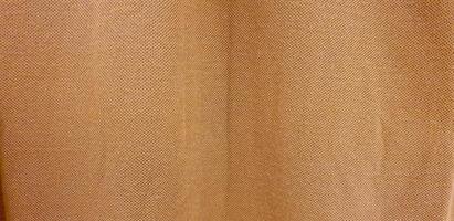 brown woven soft fabric texture. brown cotton background. copy space for image or text photo
