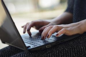 Typing female hands photo