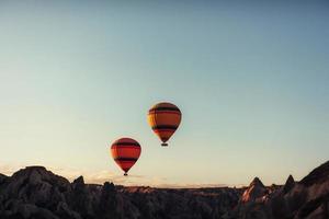 group of colorful hot air balloons against a blue sky photo