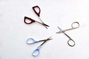 Iron nail scissors on a white background photo