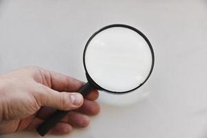 Large magnifying magnifier on a white background photo