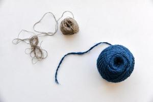 A skein of six-colored blue threads on a white background photo