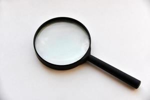 Large magnifying magnifier on a white background photo