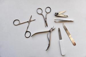 Manicure accessories scissors and file on a white background photo