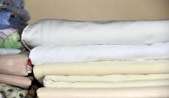Bath towel and home linen in the closet photo