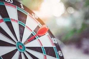 Business marketing success concept. Red dart arrow in center of the target dartboard. Bullseye is a target of business. photo