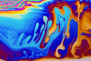 Rainbow colors. Psychedelic multi colored patterns background. Photo macro shot of soap bubbles