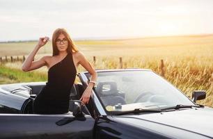 young woman in a photo shoot. She gladly posing