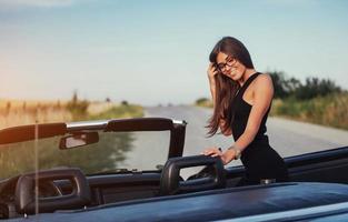 young woman in a photo shoot. She gladly posing