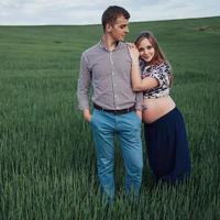 Happy couple awaiting baby. Beautiful and young parents photo