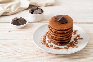 chocolate pancake stack on plate photo