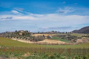 Typical landscape in Tuscany with few houses photo