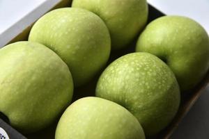 Green apples in the background close-up photo