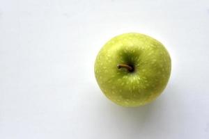 A delicious green apple on a white background photo