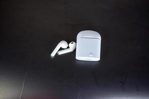 player with headphones on black background photo