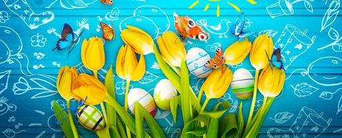 Easter background with colorful easter eggs on wooden background. photo