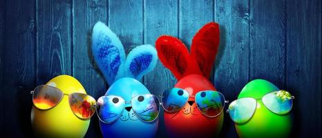 Easter background with colorful easter eggs on wooden background. photo