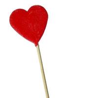 Red heart shaped lollipop isolated on white, with copyspace photo