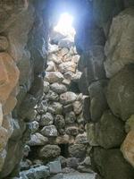 Ruins of ancient Sunuxi Nuraghe megalithic building in Sardinia, photo