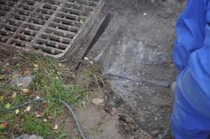 Man working on a drain in a building site photo